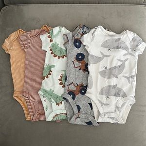 5 Carters Onsies in like new condition, no stains.